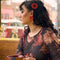 model wearing set of 2 red large button hair clips and matching earrings