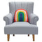 textured rainbow arch throw pillow on a grey armchair