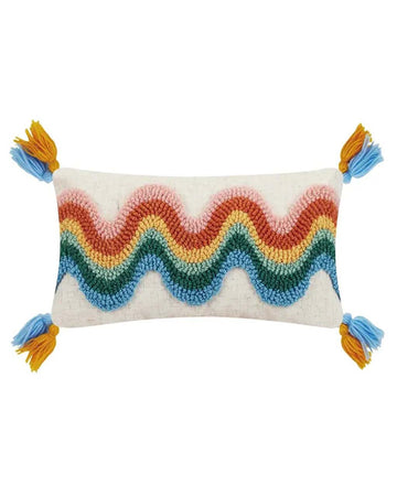 white throw pillow with wavy rainbow print and blue and yellow tassels
