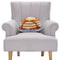 colorful pancake shaped throw pillow on a chair