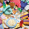 1000 piece puzzle with fun sleepover inspired graphic with a bowl of popcorn, magic 8-ball, snacks, games and phone