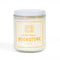 soy candle with pale yellow and white vertical stripe label and says 'smells like a bookstore' across the front
