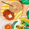 cream dinner plate with yellow wave print with cereal and waffles on it