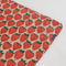 pink puffy picnic blanket with large strawberry print