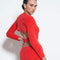 back view of model wearing red furry knit top with criss cross waist and long sleeve