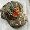 camo dad hat with orange 'HOT DOGS' across the front