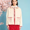 model wearing natural jacket with red ric rac trim and embroidered heart detail on front patch pockets
