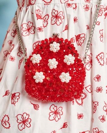 red beaded change purse with white beaded flowers