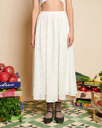 model wearing white lace midi skirt