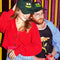 models wearing dark green dad hat with embroidered olive eyes and pickle smile