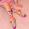 model wearing sheer socks with colorful y2k heart print