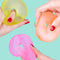 models squeezing set of three stress loops in orange, pink and yellow