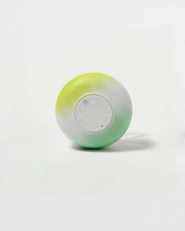 yellow, white and green circular waterproof speaker