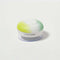 side view of yellow, white and green circular waterproof speaker with suction bottom