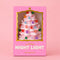 packaged pink ceramic night light with colorful glowing ornaments