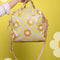 model holding yellow and lavender trippy checker skate bag with cute daisy print