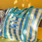 blue, white and yellow plaid large recycled plastic tote bag with ric rac detail and embroidered three fishies on the front pocket on a bench