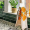 marigold tea towel over a kitchen faucet