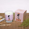 amber forest scented candle with lucy graphic