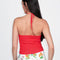 back view of model wearing red knit halter top with white flower print on the front