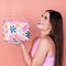 model holding cream large leatherette cosmetic case with colorful floral print