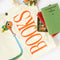 cream market tote with lowly worm graphic and 'BOOKS' on the side with a stack of books