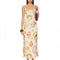 model wearing cream maxi dress with all over colorful seashell print