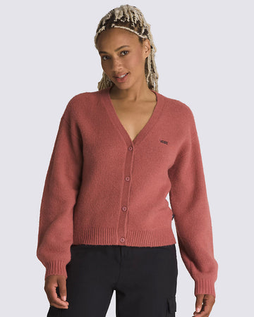 model wearing pink cropped cardigan with button front and vans logo on the left chest