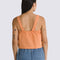 back view of model wearing peach cropped tank with square neckline