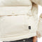 up close of model wearing cream cropped puffer jacket