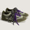 dark green and metallic sage super low pro sneakers with black and white speckled laces and purple laces