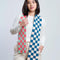 model wearing two toned checkered scarf with navy and light pink checkers and coral and mint checkers
