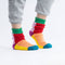 model wearing colorful color block house socks