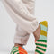 model wearing multi-color stripe fleece slippers
