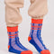 model wearing blue and lilac stripe socks with bright red trim
