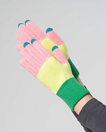 model wearing pink, yellow and green stripe tech gloves