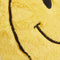 up close of yellow smiley face heating plush