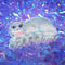 white Persian cat hair claw with pink bow on their neck on holographic tinsel