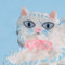 up close of white Persian cat hair claw with pink bow on their neck