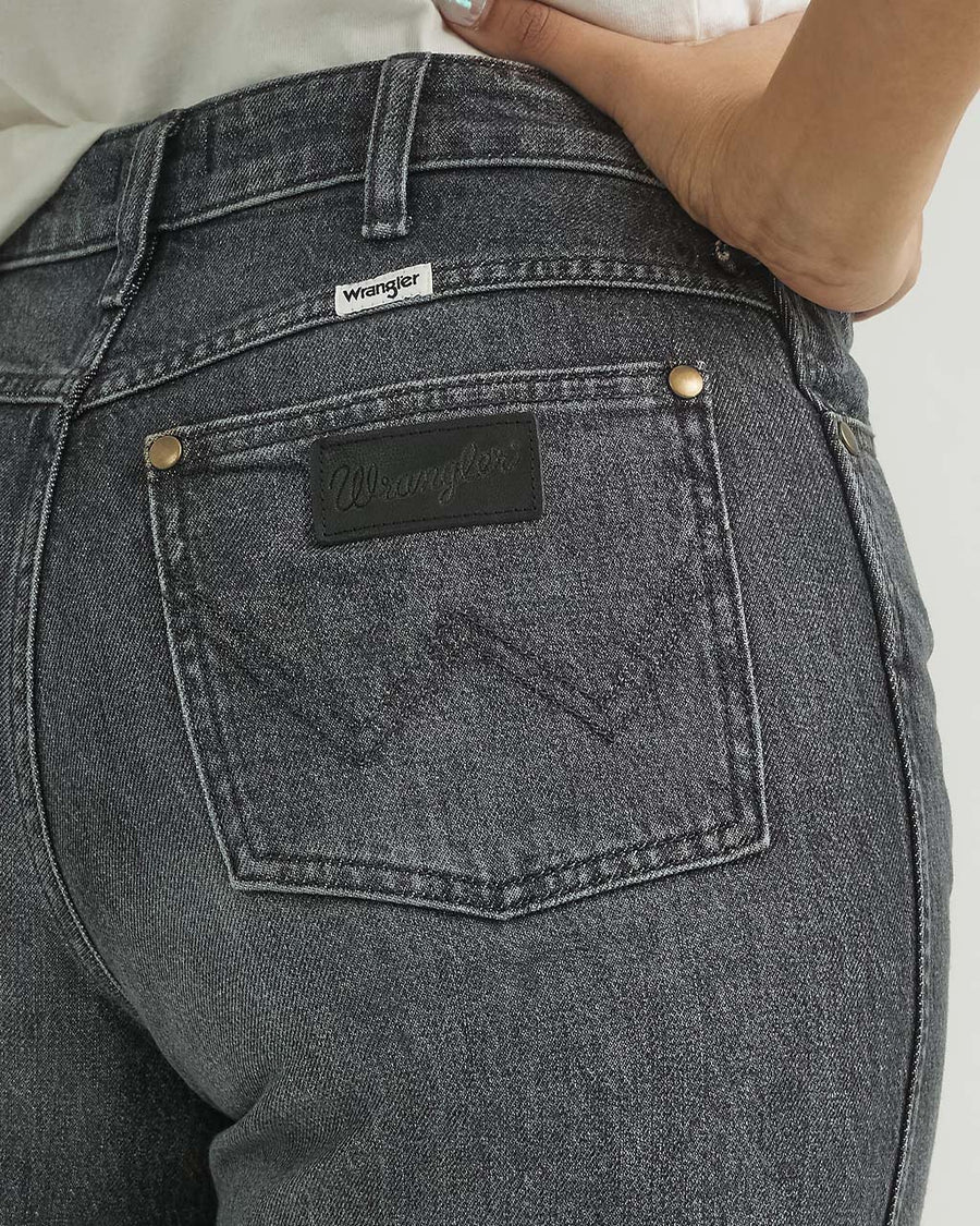 up close of black wrangler patch on back pocket