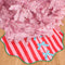 pink and red stripe tree skirt with three baby blue bows down the front and kelly green trim with a pink tree