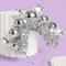 silver tinsel, disco ball and star headband leaning on a stand