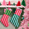 set of two striped stockings: dark green and lime green top with pink and red striped bottom and pink and red stripe top and dark green and baby blue striped bottom hanging from a mantle with gifts inside