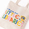 up close of canvas 'i break for little libraries' tote bag