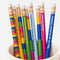 set of colorful pre-sharpened wood pencils with various book compliments on them in a cup