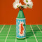 green crayon shaped flower vase with flowers inside