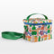 side view of white quilted lunch bag with all over charcuterie print with green and blue trim