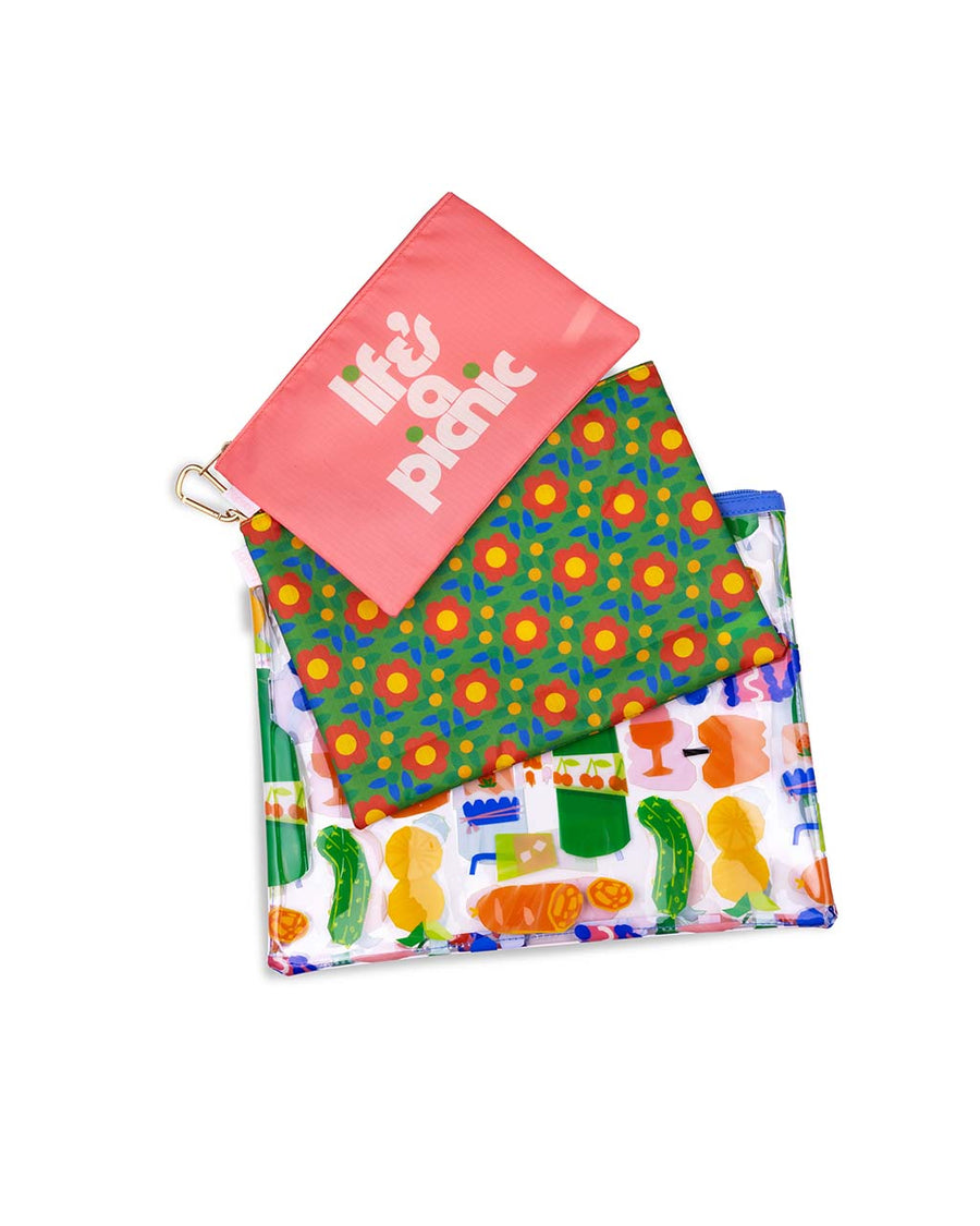 set of 3 carryall pouches: small pink 'life's a picnic', medium green with red folk floral, and large transparent picnic charcuterie print