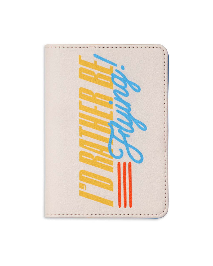 cream passport holder with retro 'i'd rather be flying' across the front