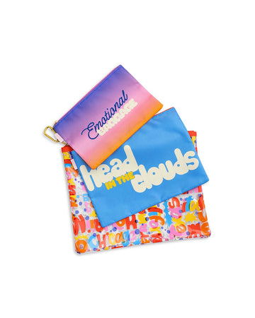 set of three travel pouches: ombre 'emotional baggage', blue 'head in the clouds' and colorful cities names